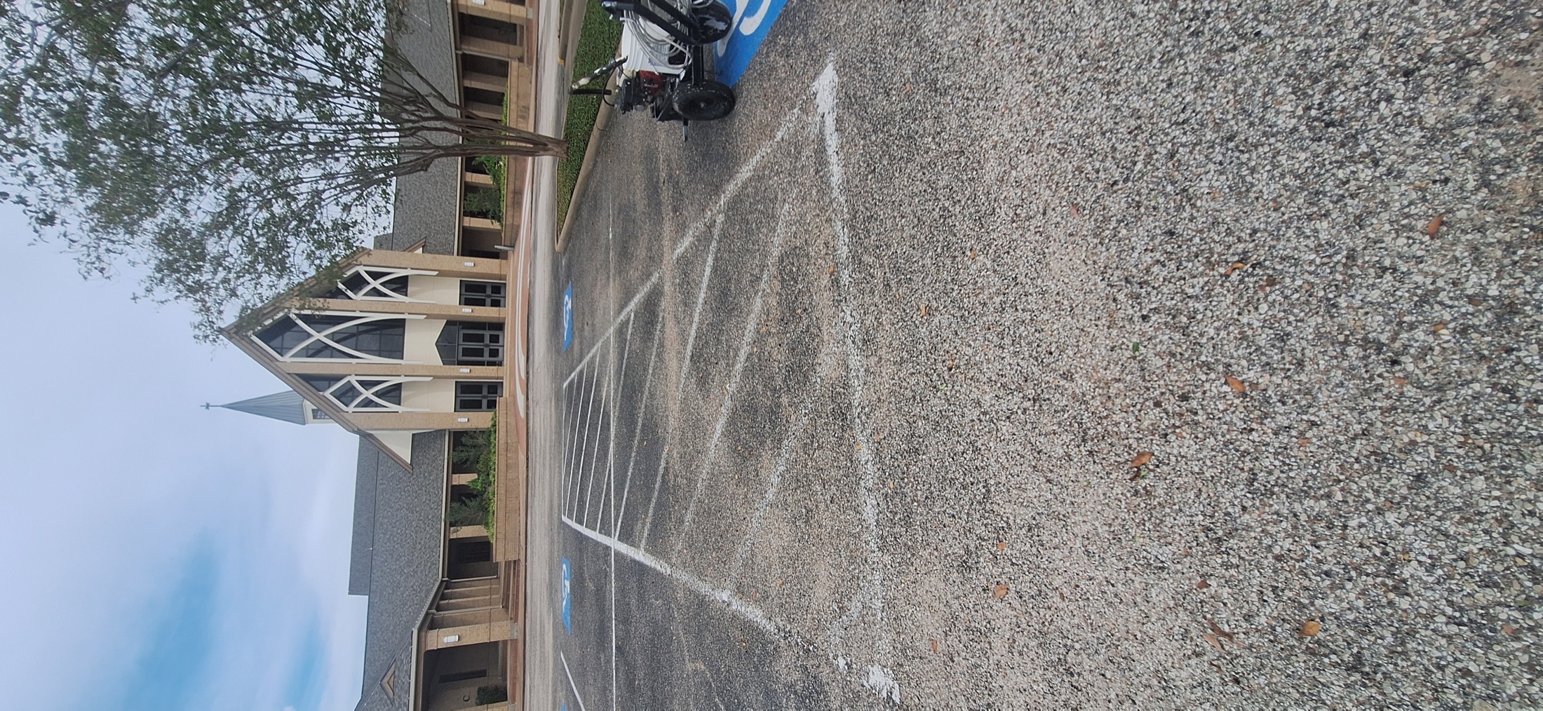 Faded white parking lines before restriping at Sugar Land Methodist Church