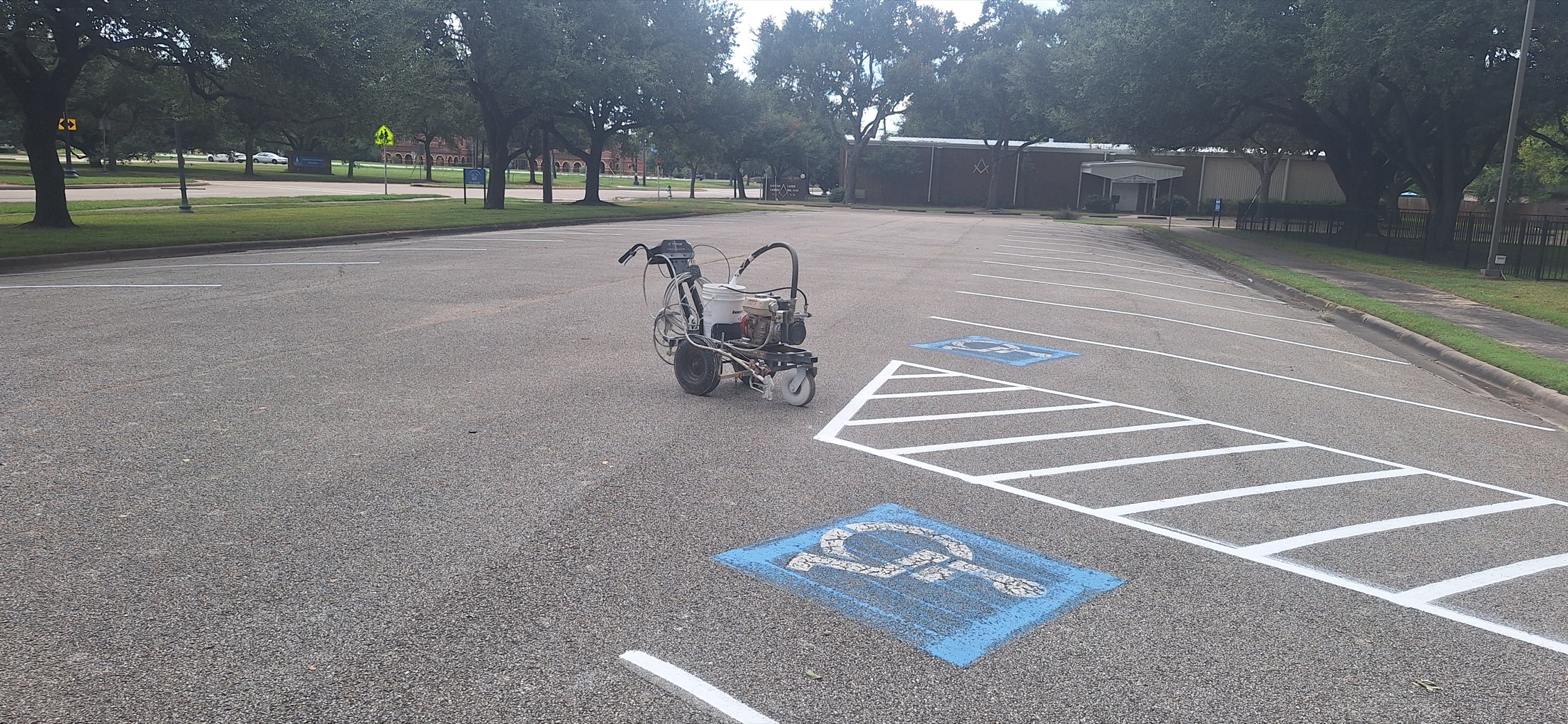 White parking lines and striping equipment at Sugar Land Methodist Church